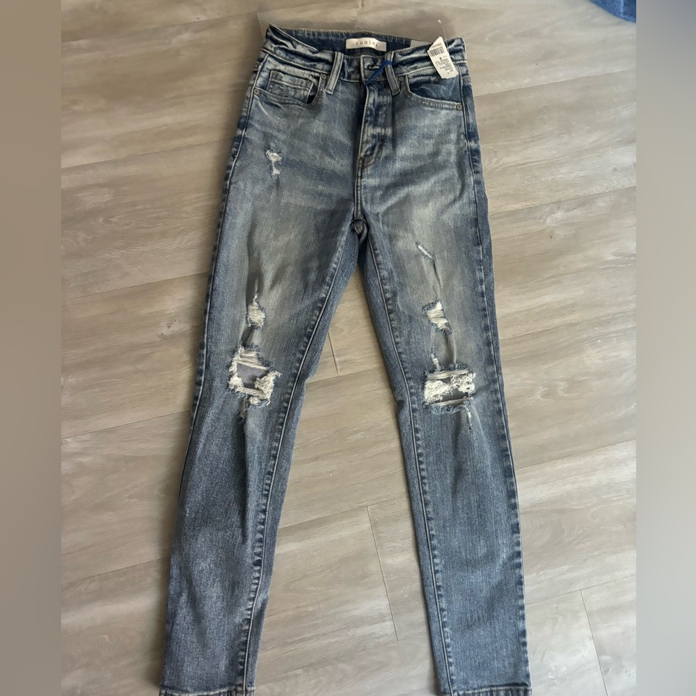 light blue ripped jeans